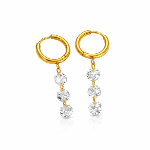 Gold hoop earrings with clear zircone on a white background